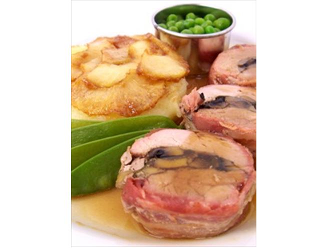 Roast Pork Tenderloin, layered with Mushroom & Sage Stuffing, wrapped in Smoked Streaky Bacon, served with Caramelised Apples on a Potato Cake with Garden Peas and White Wine Gravy
